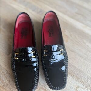 Salvatore Ferragamo Glossy Black Loafers with Gold Accents
